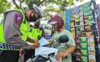 Penjual Kopi Keliling Menggunakan Sepeda Motor Terkena Operasi Zebra Jaya